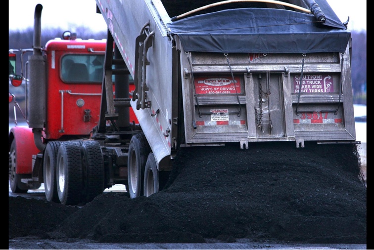 SJ-R: A semi-load of coal from Elkhart is dumped in the coal intake area at City Water, Light and Power in 2013. 